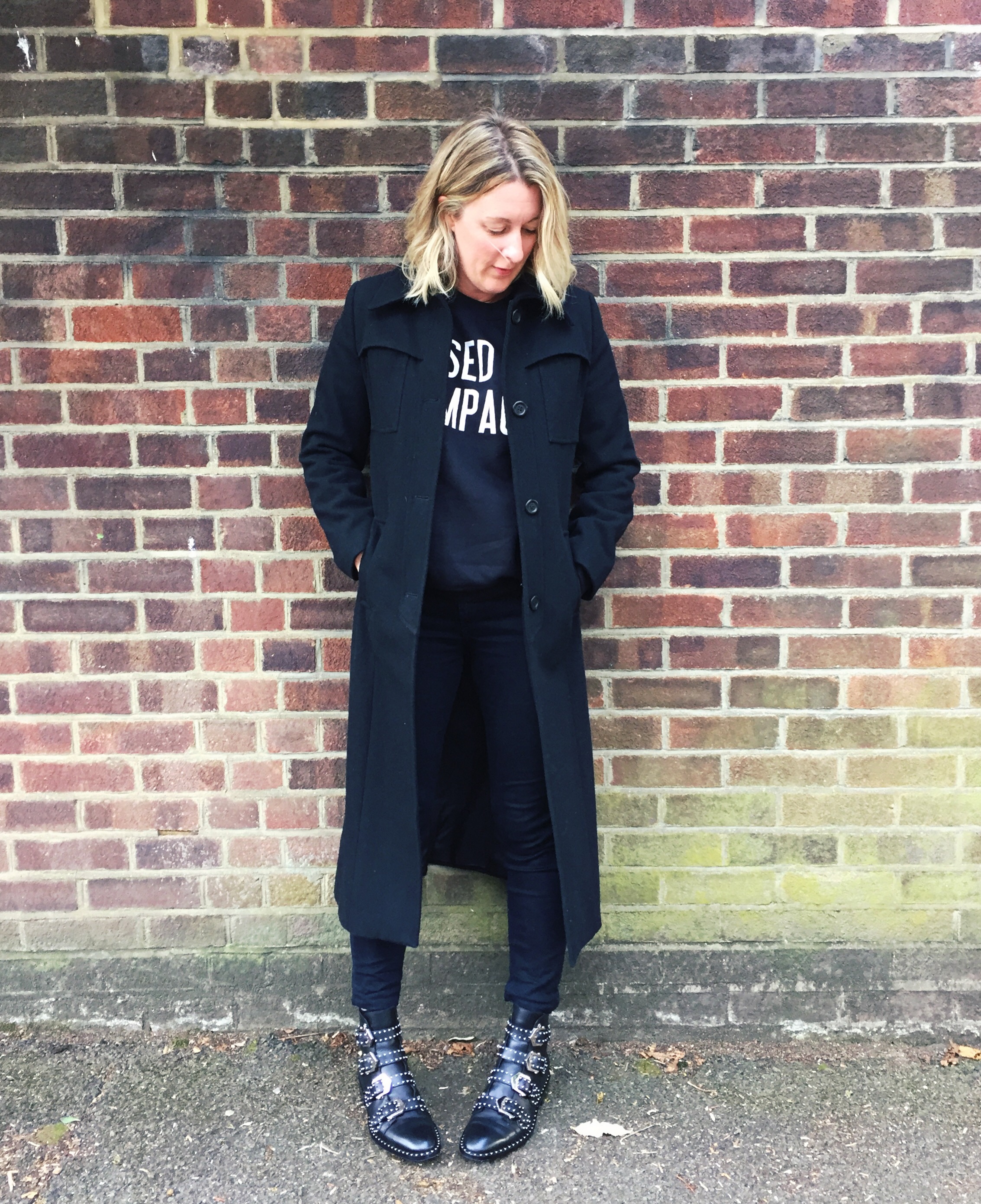 black coat black jeans black jumper givenchy boots